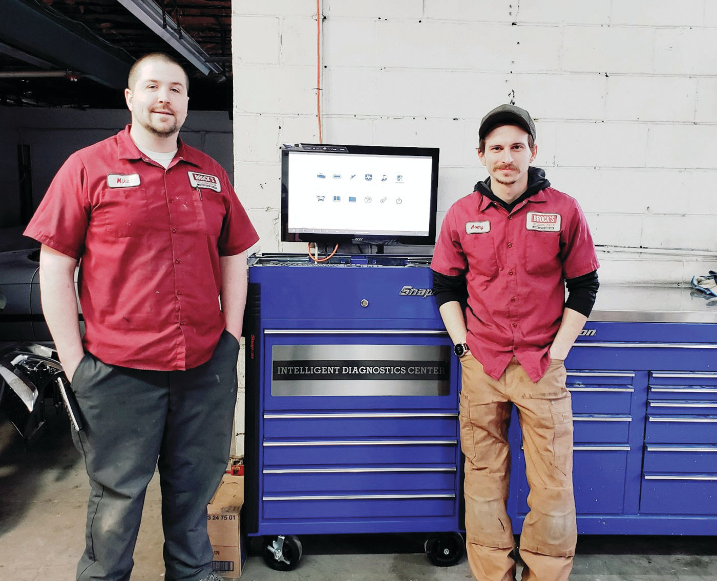 Owners of Brock’s Collision Center & Auto Repair, Mike Thoin and Avery Broccoli pause from their work for a moment to showcase the high-tech Snap-On Zeus Intelligent Diagnostic Center.  They use this sophisticated diagnostic tool is essential in today’s world of auto repair.